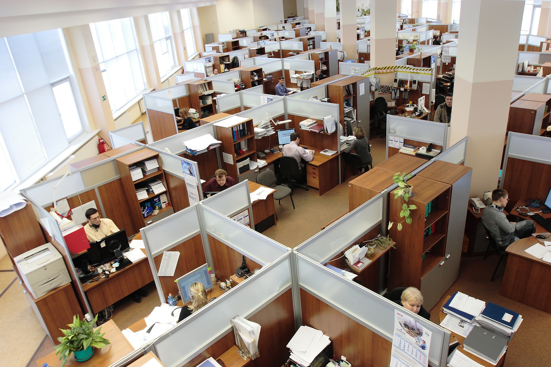work_place_office aerial view of an office with desks and people working